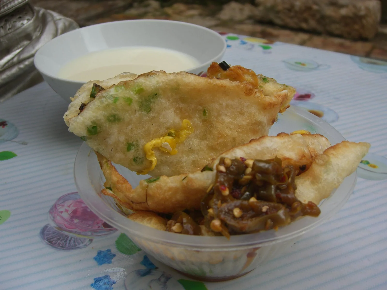 Crisp Lijiang baba bread with egg and spring onion served on a plate