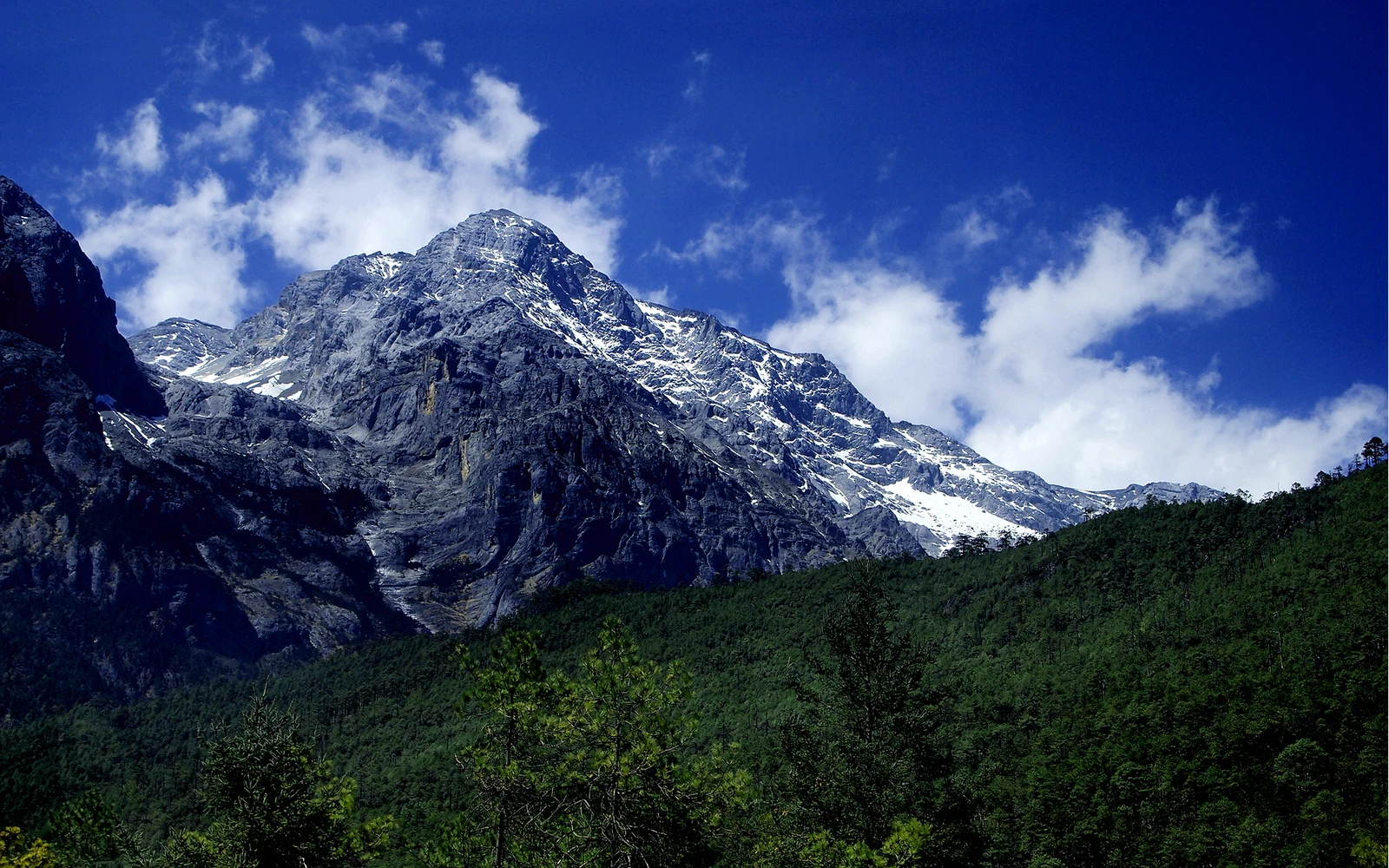 Snow-covered Jade Dragon Snow Mountain under a deep blue sky