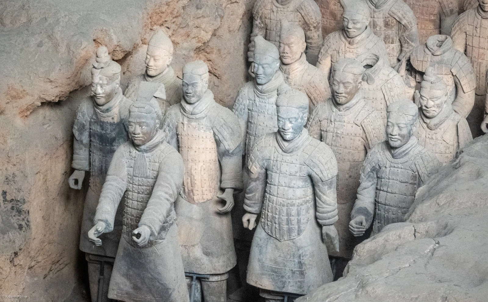 Close view of individual armored warriors in the Terracotta Army excavation