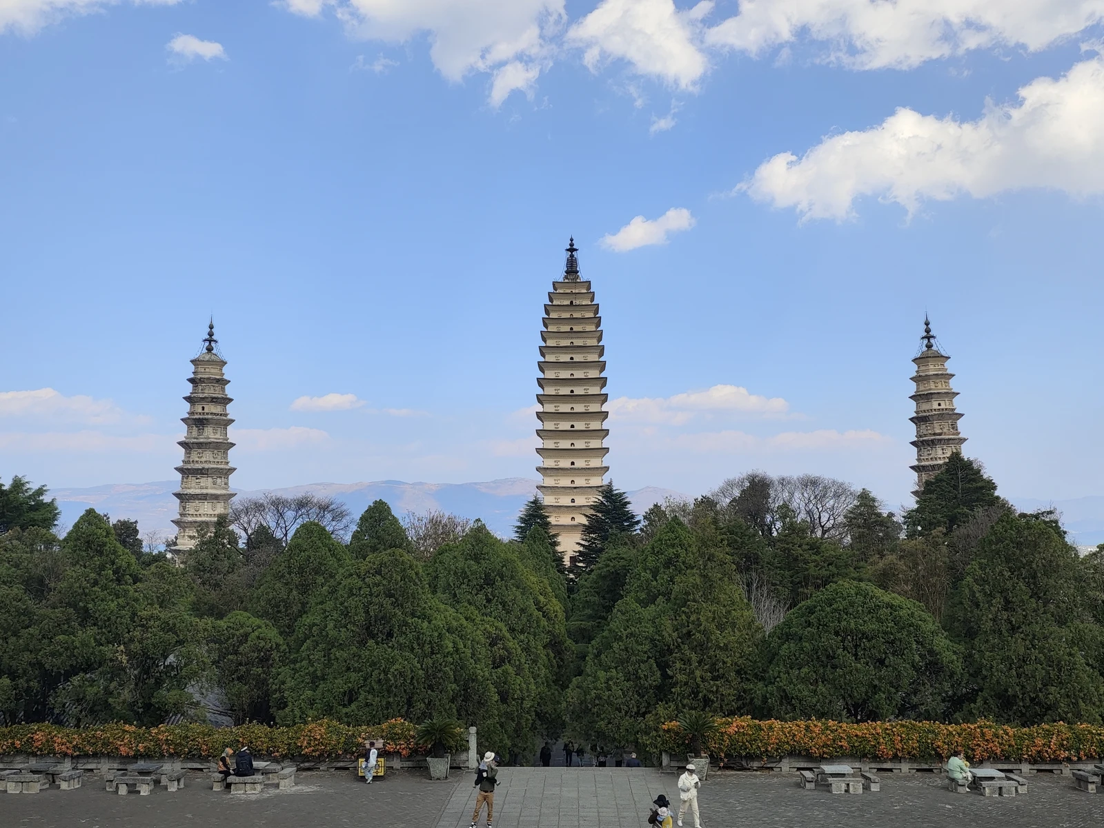 The three pagodas of Chongsheng Temple beneath a bright blue sky in Dali