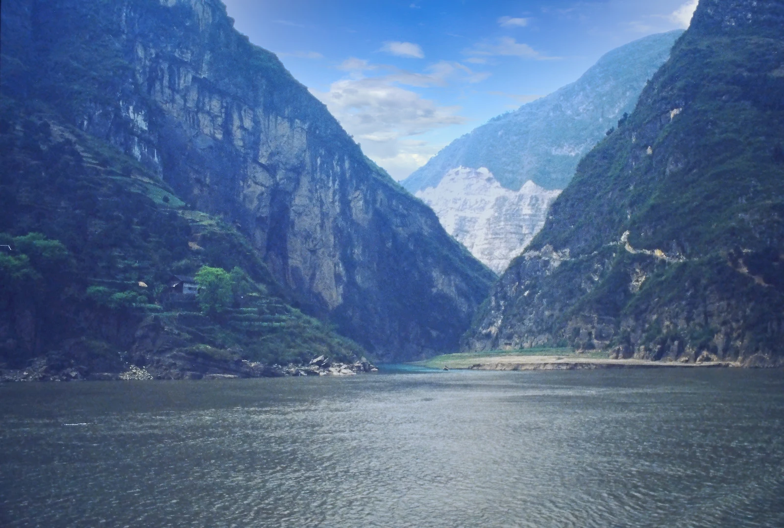 A wide view of the Yangtze River flowing between the cliffs of the Three Gorges